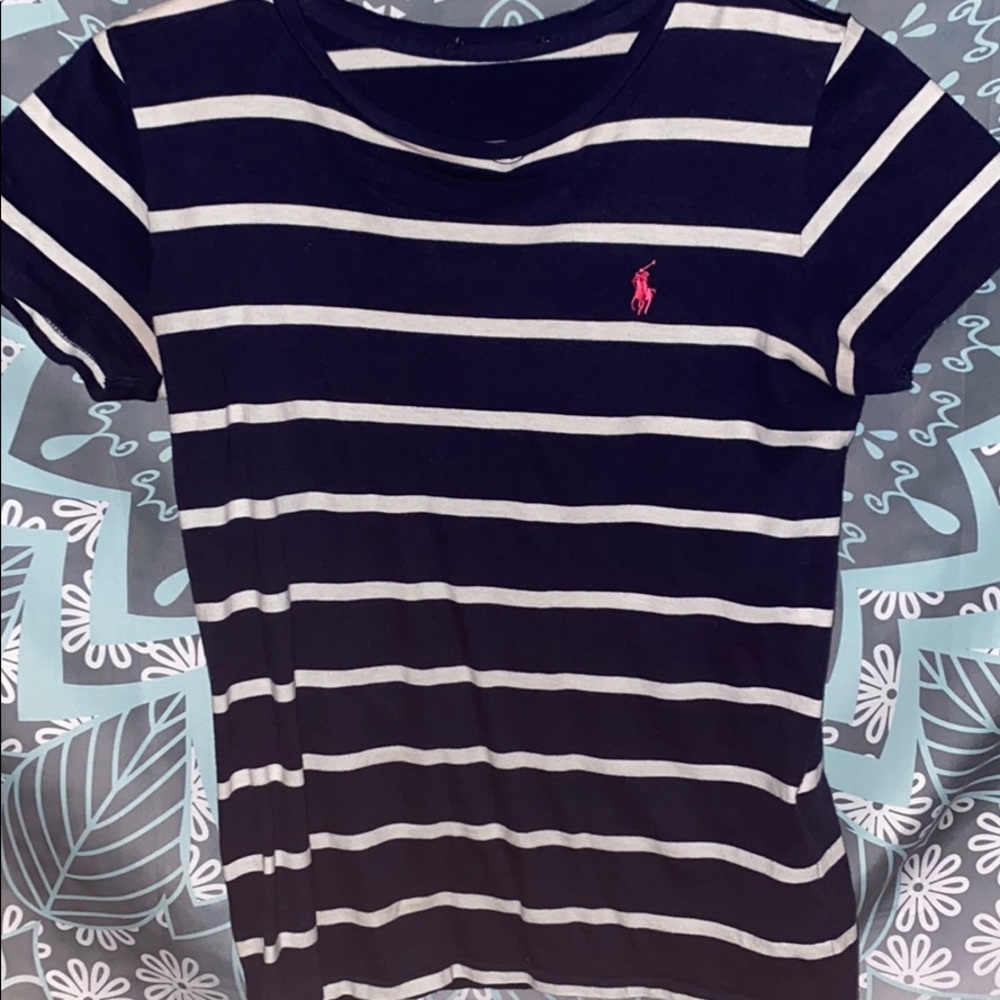 Navy blue and white polo shirt .